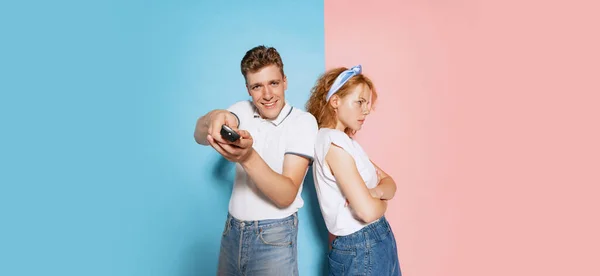 Portrait Young Couple Isolated Pink Blue Studio Background Man Turning — стоковое фото