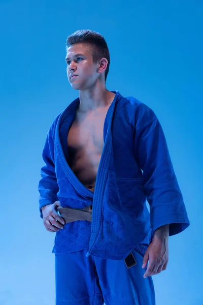 Portrait Young Muscular Man Martial Art Coach Blue Kimono Posing — стоковое фото