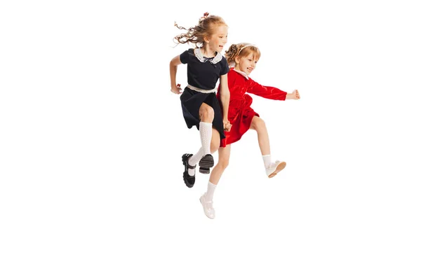 Portrait Two Cheerful Girls Children Jumping Puddle Running Isolated White — 图库照片