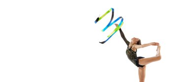 Portrait of young sportive girl, female rhythmic gymnast performing with colorful ribbons isolated over white studio background. Concept of action, motion, sport life, competition. Copyspace for ad