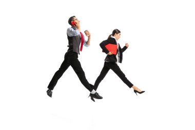 Portrait of man and woman, business people working on their way, posing in action isolated over white background. Concept of business, office lifestyle, success, ballet, career, expression, ad