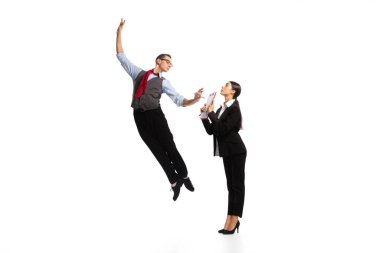 Portrait of business people, woman giving to a jumping man a contract to sign isolated on white background. Concept of business, office lifestyle, success, ballet, career, expression, ad
