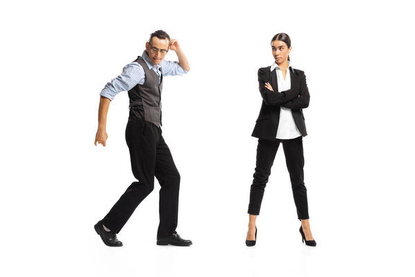 Portrait of office workers, man dancing near woman, employee isolated on white background. Professional growth. Concept of business, office lifestyle, success, ballet, career, expression, ad