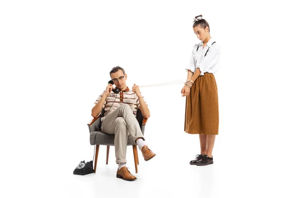 Portrait Man Talking Phone Holding Woman Rope Isolated White Background — Photo