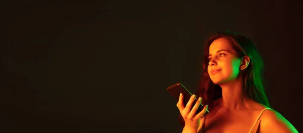 Portrait Beautiful Young Woman Recording Voice Message Isolated Brown Studio — Fotografia de Stock