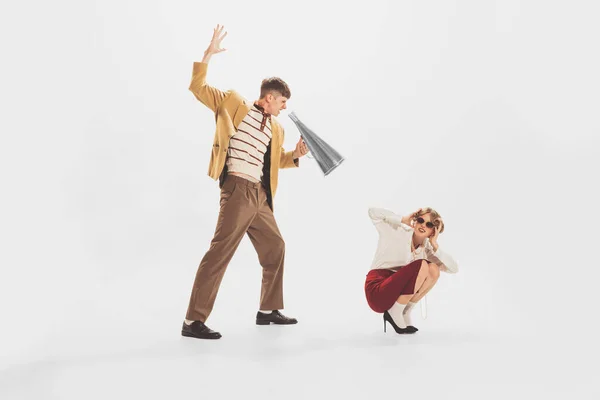 Portrait Young Man Yellow Jacket Shouting Stylish Woman Megaphone Isolated — Stockfoto