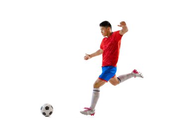 Dynamic portrait of young man, professional football player in motion, training, dribbling ball isolated over white background. Concept of sport, team game, action, motion. Copy space for ad, poster
