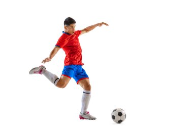 Portrait of young man, professional football player in motion, training, dribbling ball isolated over white studio background. Concept of sport, team game, action, motion. Copy space for ad, poster