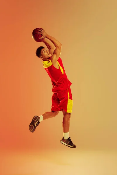 Portrait Young Muscular Man Basketball Player Training Playing Isolated Orange — Foto Stock