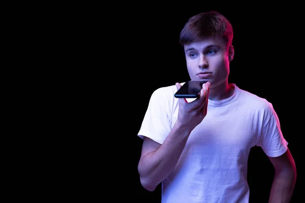 Portrait Young Man White Shirt Posing Recording Voice Message Phone — Stok fotoğraf