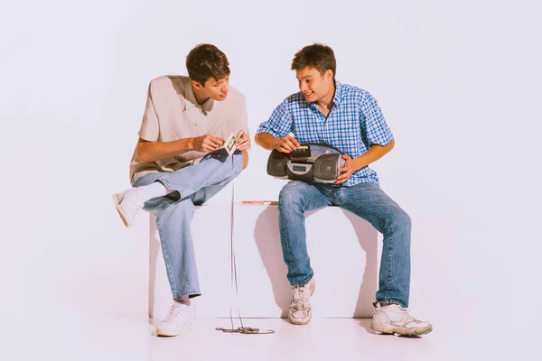 Portrait Two Boys Sitting Together Music Discs Isolated Grey Background — Photo