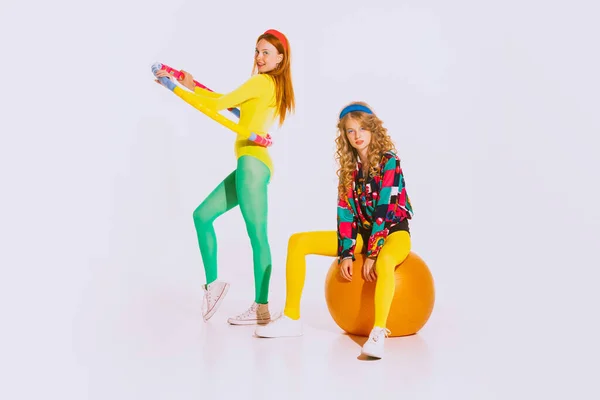 Portrait Stylish Young Girls Bright Clothes Doing Fitness Posing Isolated — Fotografia de Stock