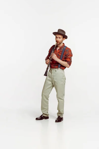 Stylish Young Man Red Checkered Shirt Hat Playing Clarinet Isolated — Stock Fotó