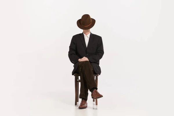 Portrait Stylish Man Brown Suit Sitting Chair Covering Face Hat — Stock Photo, Image