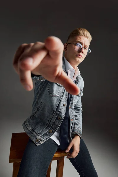 Portrait Young Man Blonde Hair Sitting Chair Posing Sunglasses Jeans — Stock Photo, Image