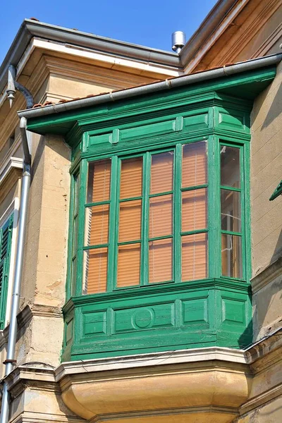 bay window, enclosed window, architectural details, a fragment of a building protruding from the facade, green bay window, architectural art, Middle East influences
