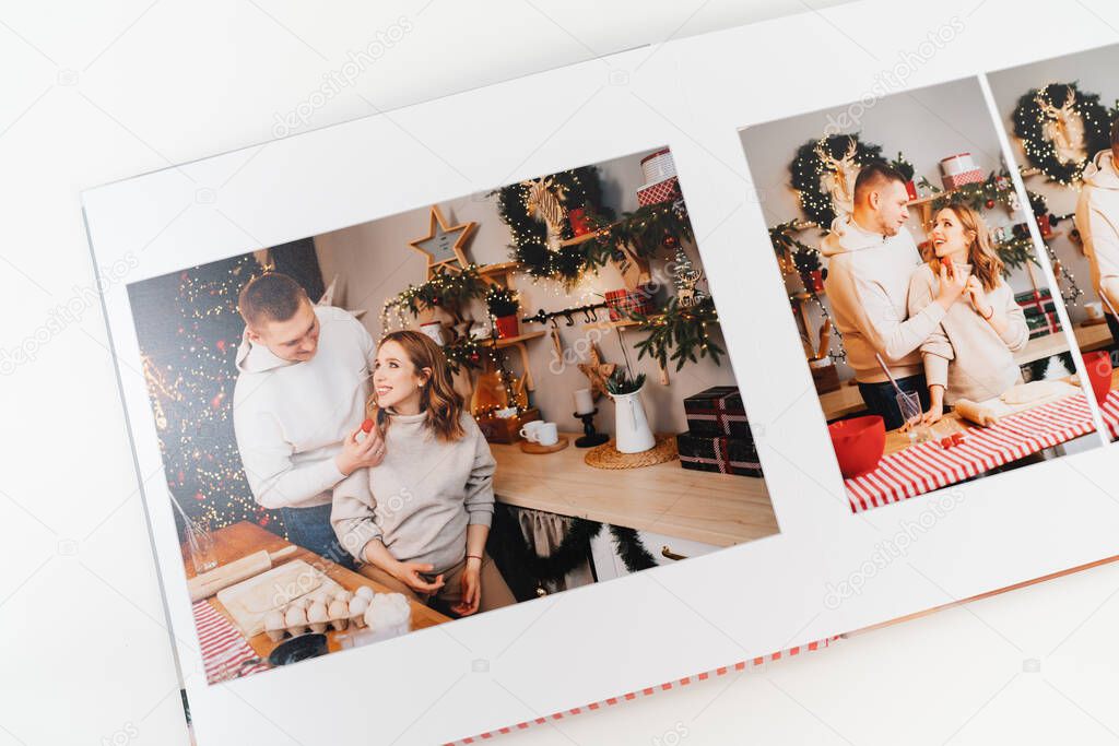 page photobook from photo shoot of couple during pregnancy in new years kitchen