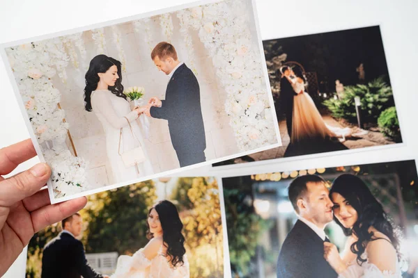 Impresso em fotos de papel da noiva e do noivo. — Fotografia de Stock