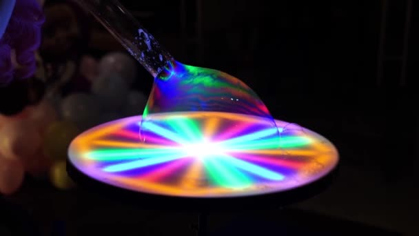Show of soap bubbles with multi-colored lighting. beautiful performance in dark. — Stock Video