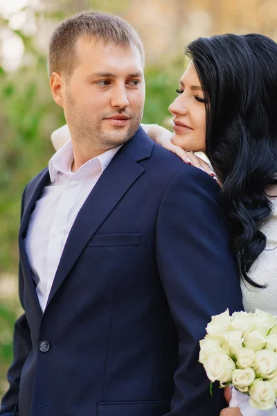 Newlyweds. a man and a woman in love in wedding dresses. — Stockfoto