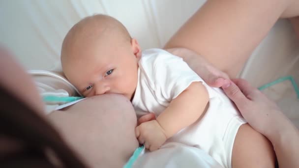 Breastfeeding. view from above. the mother feeds the baby with breast milk. — 图库视频影像