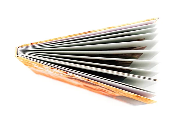 Top view of the spine and pages of the photobook from a family photo shoot. — Stock Photo, Image