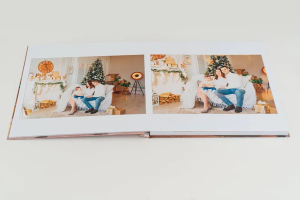 Photobook spread with photos of family photo shoot. — Stock Photo, Image