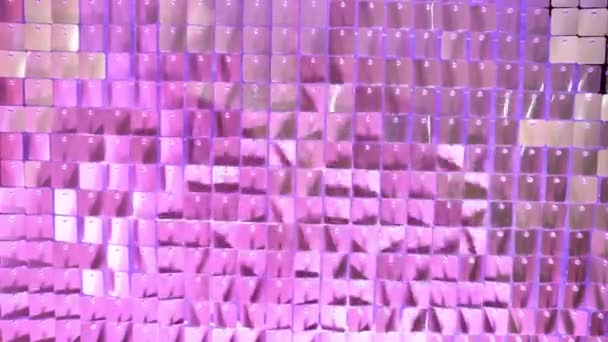 In purple light. Wall Made Of Many Square Sparkling Sequins. Photo Zone — Stock Video