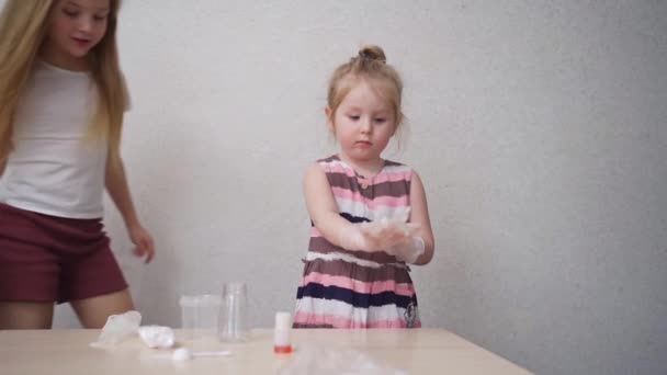 A cute little girl wear protective gloves before experimenting. — Stock Video