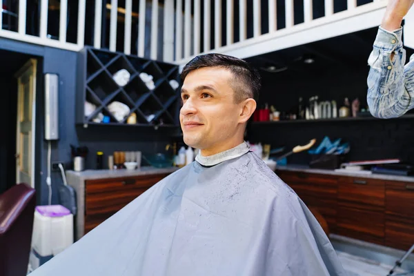 A man at a barbershop. mens haircut and hair care. — Stock Photo, Image