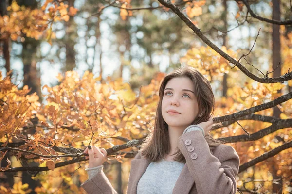 Portrait of a thoughtful and sad girl. Autumn colors . Lifestyle. Autumn mood. Forest