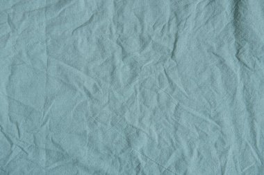Buruşmuş yeşil kumaş dokusu. 