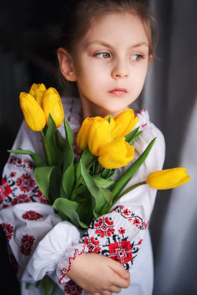 Little Ukrainian Girl Traditional Clothes Holds Yellow Tulips Her Hands — Stock Photo, Image