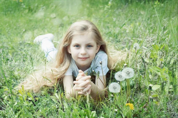 Image Pretty Little Girl Lying Dandelions Field Happy Cheerful Girl — Zdjęcie stockowe