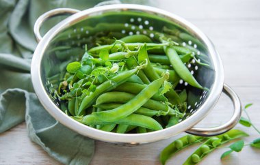 Young fresh juicy pods of green peas. Healthy organic food. 
