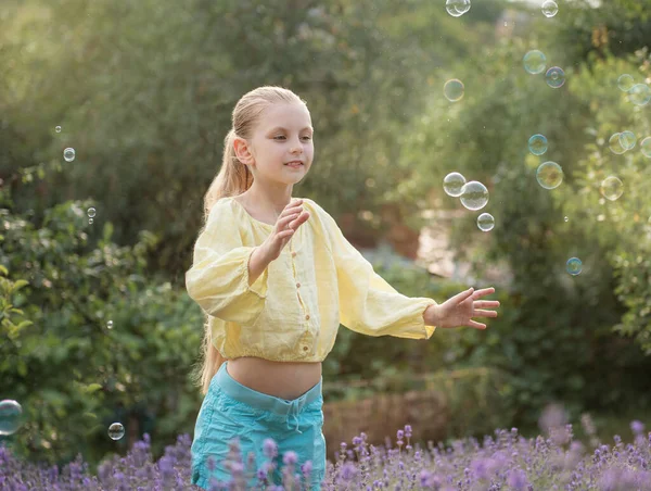 Beautiful Little Girl Catches Soap Bubbles Field Lavender — Photo