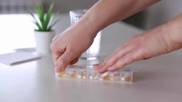 Medical pill box with tablet doses for daily take medicine with drugs, capsules — Stock Video