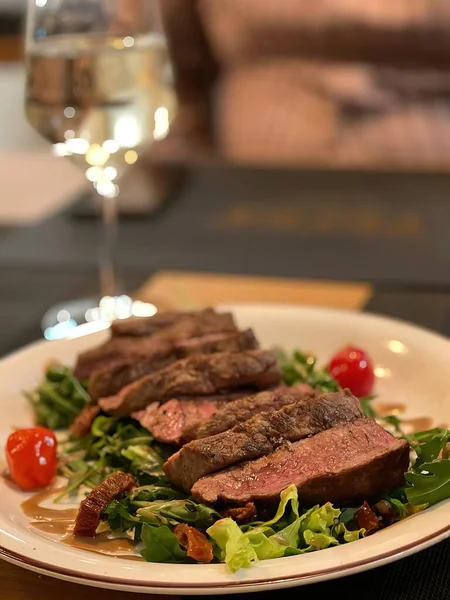 Steak and wine served in restaurant