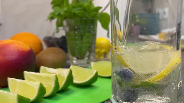 Pour Sparkling Water Blueberries Lemon Mint Glass Concept Filling — 图库视频影像