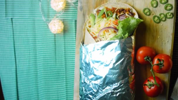 Very Large Burrito Avocado Chorizo Meat Filming Romantic Setting — Stock Video