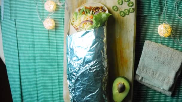 Very Large Burrito Avocado Chorizo Meat Filming Romantic Setting — Stock Video