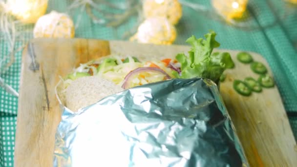 Very Large Burrito Avocado Chorizo Meat Filming Romantic Setting — Stock Video