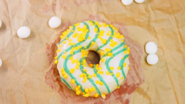 Yellow Donuts Decorated Blue Icing Donuts Piece Paper Decorated Candy — Stock Video