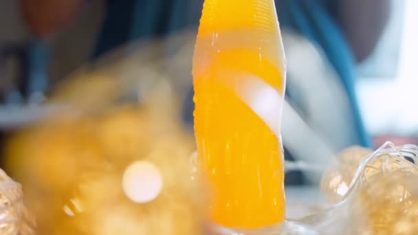 Fresh Orange Water Bottle Woman Pours Water Glass Macro Slider — Stockvideo