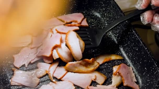 Cook Stirs Frying Bacon Spoon Camera Follows Cooking Bacon Grill — Stock Video