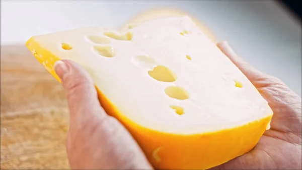 Woman Holds Her Hands Piece Cheese Holes Slider Filmed Cheese — Stock Photo, Image