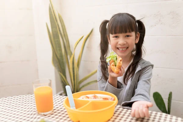 Happy Young Asian Girl Eating Breakfast Orange Juice Table Home — ストック写真