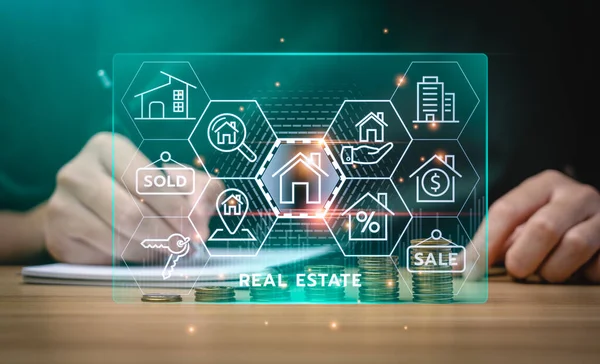 real estate concept, Businessman or home broker with virtual hologram property value on laptop screen. Searching and investing in real estate buy a new home for the family, home search, property tax