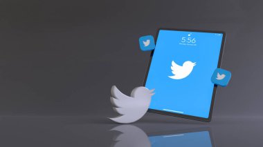 Uygulama logosunu gösteren bir tabletin önündeki Twitter logosunun 3B yorumlaması.