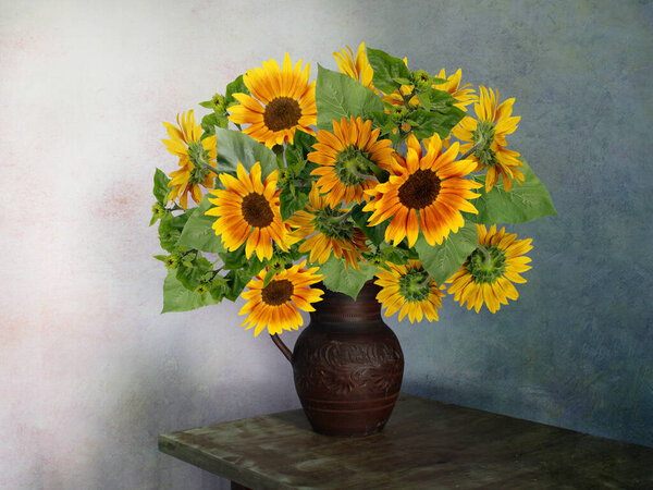 Still life with beautiful yellow sunflowers.A bouquet of flowers .